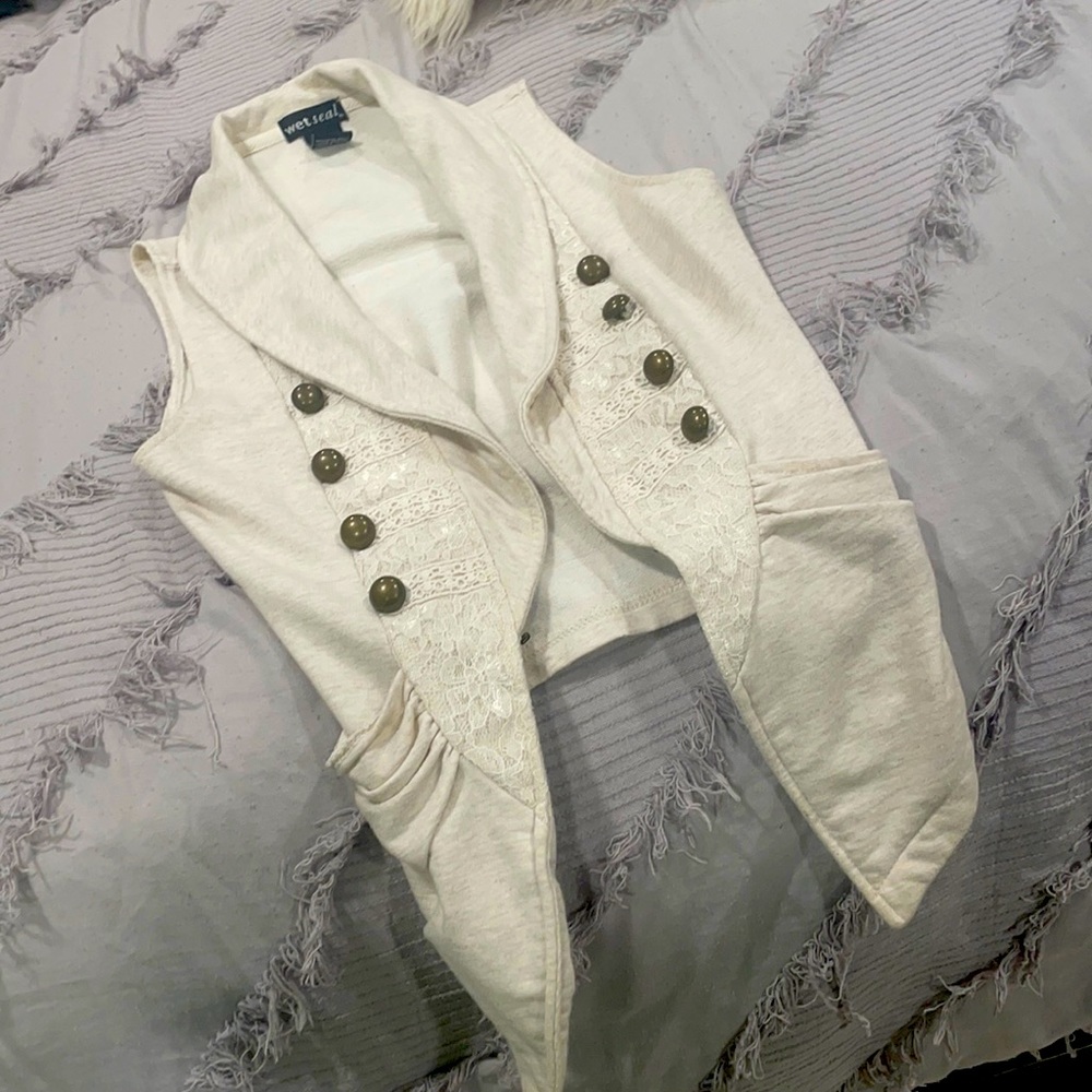 Wet seal cute vest it goes almost with everything